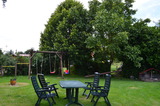 Ferienwohnung in Wangels - Bauernhof Blunck - Spielplatz und Sitzgruppe