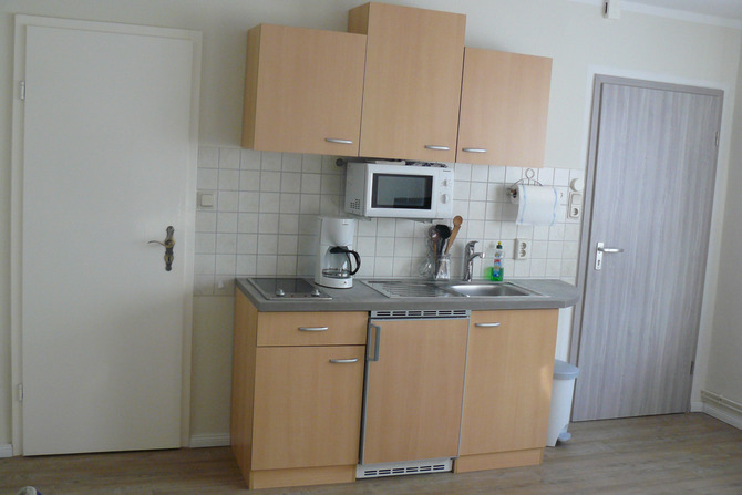 Ferienwohnung in Diedrichshagen - Krüger - Wohnzimmer- Küchenzeile